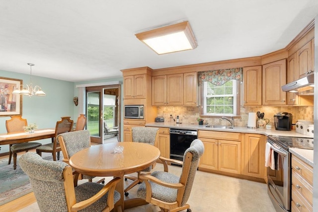 55 Glen Rd, Wilmington, MA 01887 - kitchen with stainless steel appliances, under cabinet range hood, a sink, backsplash, and light countertops