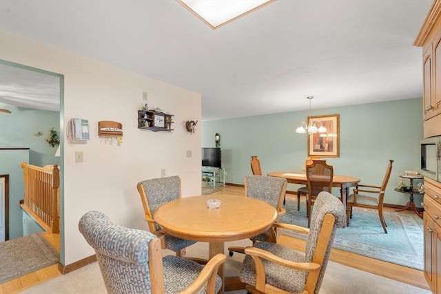 55 Glen Rd, Wilmington, MA 01887 - dining room with baseboards and a chandelier