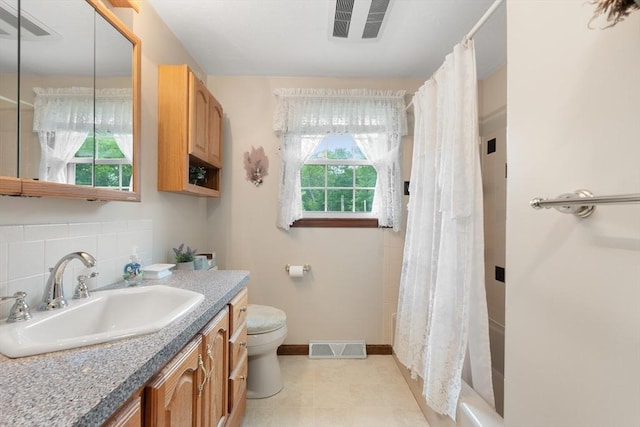 55 Glen Rd, Wilmington, MA 01887 - full bath with toilet, vanity, curtained shower, and baseboards