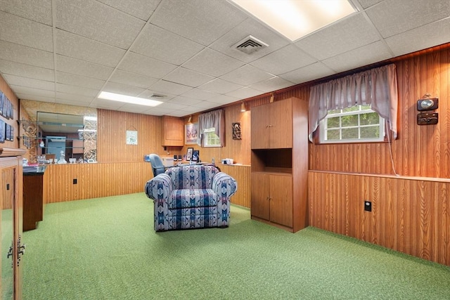 55 Glen Rd, Wilmington, MA 01887 - living area with wood walls, carpet, and a drop ceiling