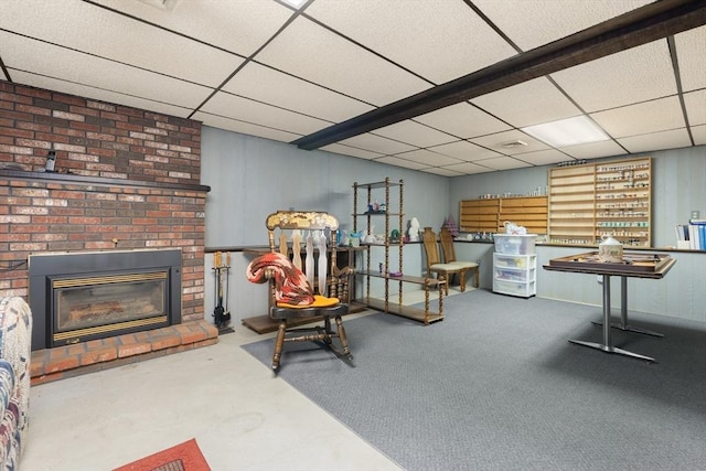 55 Glen Rd, Wilmington, MA 01887 - sitting room featuring a drop ceiling, a fireplace, and concrete flooring