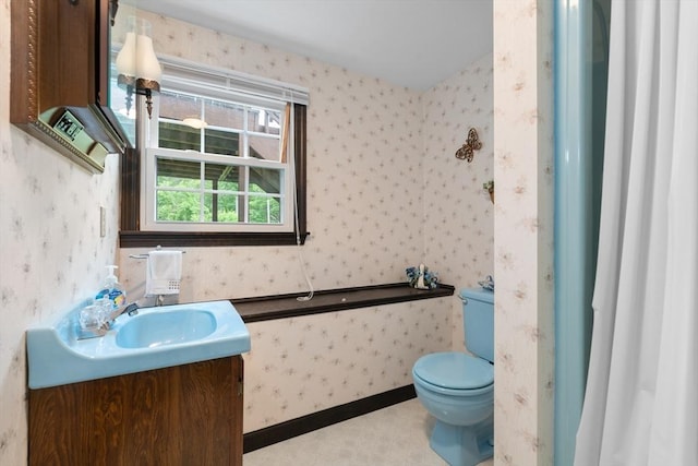 55 Glen Rd, Wilmington, MA 01887 - bathroom featuring wallpapered walls, vanity, toilet, and a shower