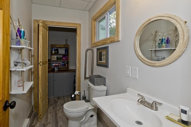 10 Dorchester, Springfield, MA 01109 - bathroom featuring wood finished floors, vanity, toilet, and a drop ceiling