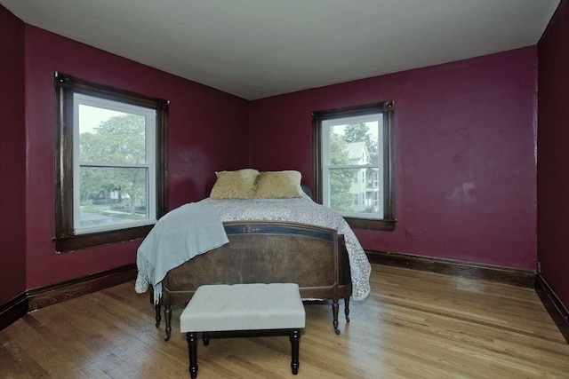 10 Dorchester, Springfield, MA 01109 - bedroom featuring multiple windows, wood finished floors, and baseboards
