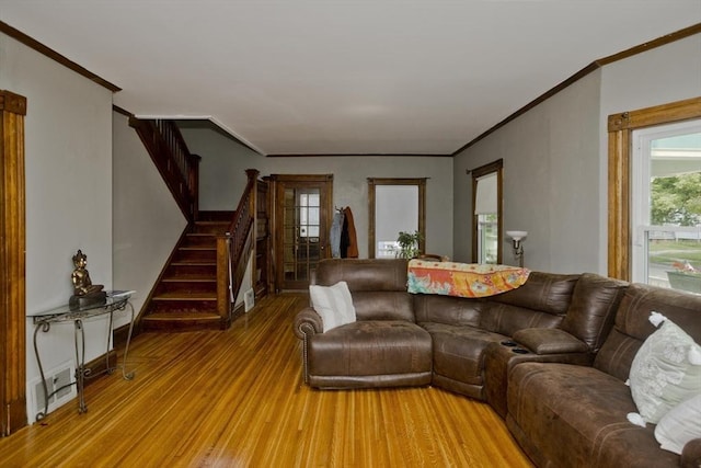 10 Dorchester, Springfield, MA 01109 - living area featuring light wood finished floors, crown molding, and stairs