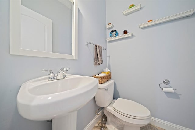 867 Adams St Unit 867, Boston, MA 02124 - bathroom featuring toilet, baseboards, and a sink