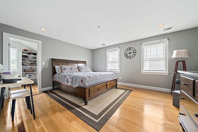 867 Adams St Unit 867, Boston, MA 02124 - bedroom with light wood-type flooring, multiple windows, baseboards, and recessed lighting