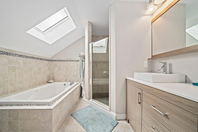 867 Adams St Unit 867, Boston, MA 02124 - bathroom featuring a skylight, a stall shower, vanity, a garden tub, and tile patterned flooring