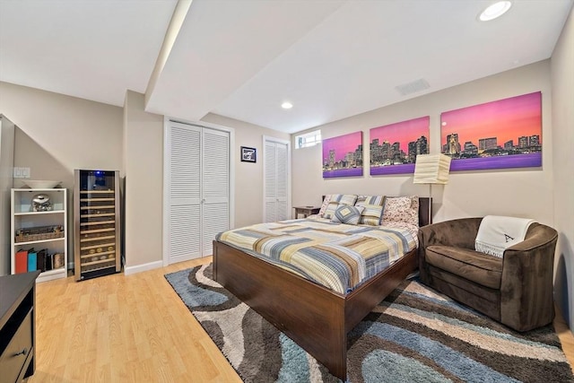 867 Adams St Unit 867, Boston, MA 02124 - bedroom with wine cooler, wood finished floors, recessed lighting, and baseboards