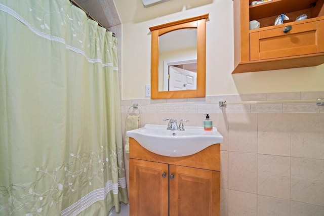 867 Adams St Unit 867, Boston, MA 02124 - bathroom with vanity, tile walls, a shower with shower curtain, and a wainscoted wall