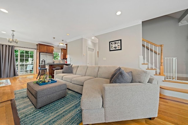 867 Adams St Unit 867, Boston, MA 02124 - living area featuring stairs, a chandelier, recessed lighting, crown molding, and light wood-style floors