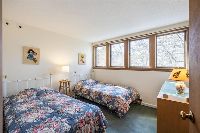 bedroom with carpet flooring and baseboards