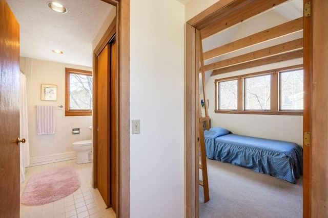 corridor with recessed lighting and tile walls