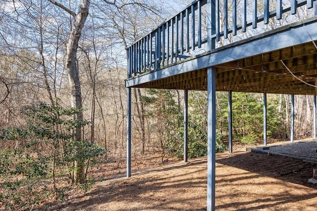 exterior space featuring a wooden deck and a carport