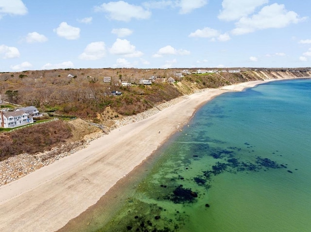 bird's eye view with a water view and a view of the beach