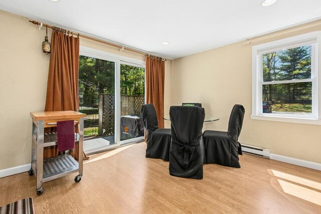 300 Falmouth Rd Unit 12E, Mashpee, MA 02649 - dining area featuring baseboard heating, healthy amount of natural light, baseboards, wood finished floors, and recessed lighting