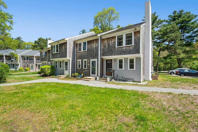 300 Falmouth Rd Unit 12E, Mashpee, MA 02649 - view of front facade with a front yard and a chimney