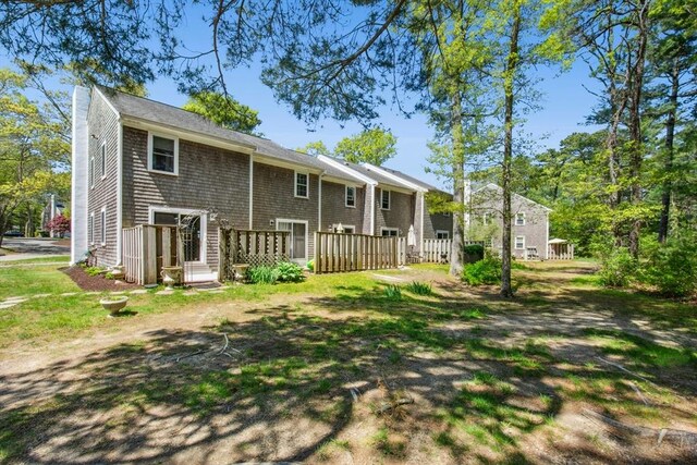 300 Falmouth Rd Unit 12E, Mashpee, MA 02649 - rear view of property with a chimney