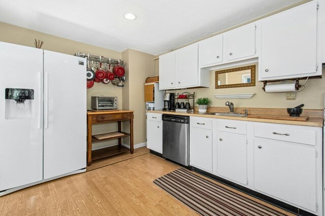 300 Falmouth Rd Unit 12E, Mashpee, MA 02649 - kitchen featuring white fridge with ice dispenser, stainless steel dishwasher, a sink, light countertops, and white cabinets