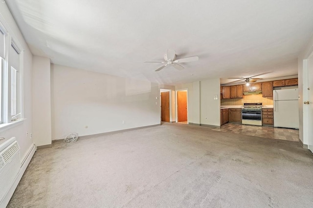 unfurnished living room featuring a baseboard radiator, light colored carpet, ceiling fan, and baseboards