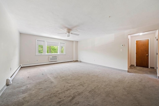 carpeted spare room with baseboards, a baseboard radiator, ceiling fan, and an AC wall unit