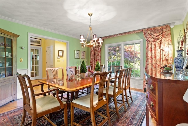 29 Stop River Rd, Norfolk, MA 02056 - dining area featuring a chandelier, crown molding, and wood finished floors
