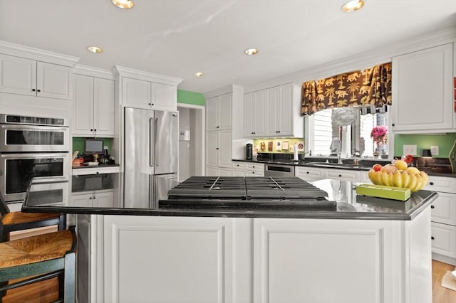 29 Stop River Rd, Norfolk, MA 02056 - kitchen with stainless steel appliances, dark countertops, a center island, a sink, and white cabinets