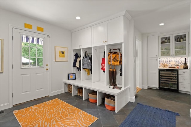 29 Stop River Rd, Norfolk, MA 02056 - mudroom with beverage cooler, bar area, recessed lighting, baseboards, and dark tile patterned floors