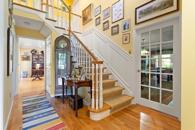 29 Stop River Rd, Norfolk, MA 02056 - staircase featuring wood finished floors, a high ceiling, and plenty of natural light