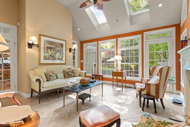 29 Stop River Rd, Norfolk, MA 02056 - living area featuring a ceiling fan, a skylight, high vaulted ceiling, light tile patterned flooring, and baseboards