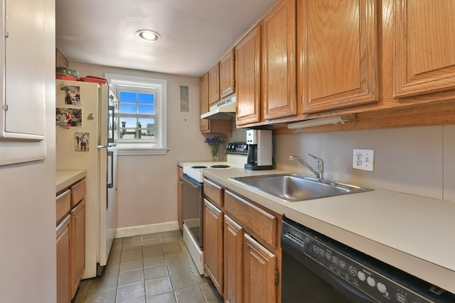 kitchen featuring light tile patterned flooring, sink, and white appliances