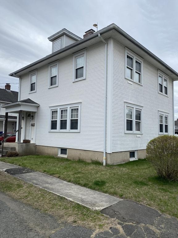 7 Exchange St, Westfield, MA 01085 - view of property exterior featuring a chimney and a lawn