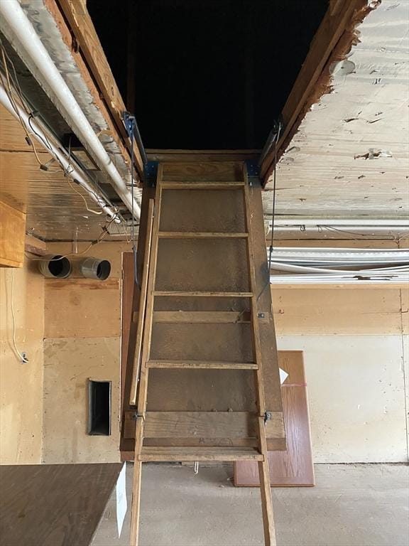 7 Exchange St, Westfield, MA 01085 - staircase featuring unfinished concrete flooring