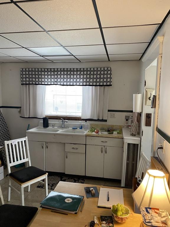 7 Exchange St, Westfield, MA 01085 - kitchen with a drop ceiling, a sink, and light countertops