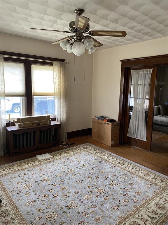 7 Exchange St, Westfield, MA 01085 - unfurnished room featuring a ceiling fan, baseboards, and wood finished floors