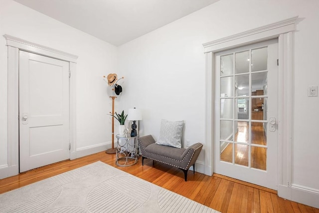 sitting room featuring wood finished floors and baseboards