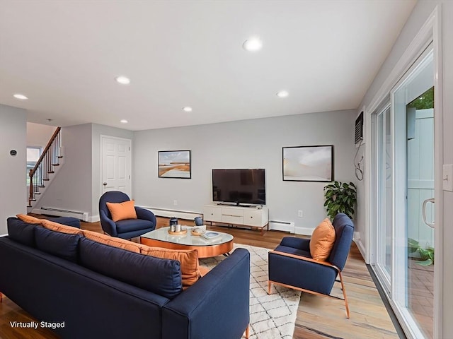 48 Decarolis Dr Unit 48, Tewksbury, MA 01876 - living area featuring a baseboard heating unit, light wood-style flooring, recessed lighting, and stairway