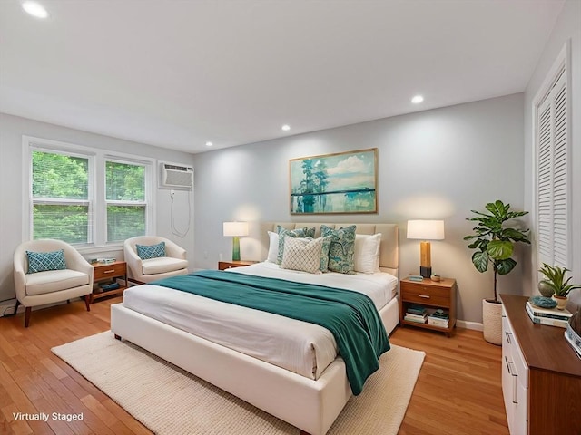 48 Decarolis Dr Unit 48, Tewksbury, MA 01876 - bedroom featuring light wood-type flooring, recessed lighting, and an AC wall unit