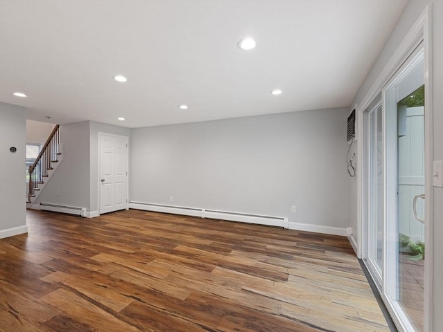 48 Decarolis Dr Unit 48, Tewksbury, MA 01876 - empty room with baseboard heating, wood finished floors, recessed lighting, and stairs