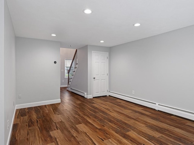 48 Decarolis Dr Unit 48, Tewksbury, MA 01876 - spare room with baseboard heating, dark wood-style floors, recessed lighting, and stairway