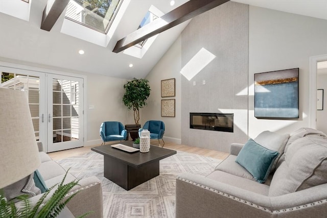 living room with a skylight, high vaulted ceiling, wood finished floors, recessed lighting, and baseboards