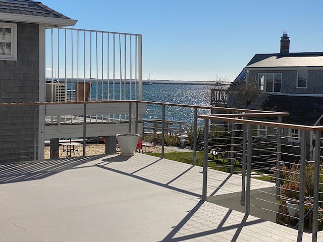 balcony featuring a water view