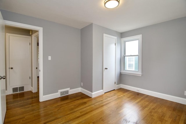 63 Grandview St, Springfield, MA 01118 - empty room with wood finished floors and baseboards