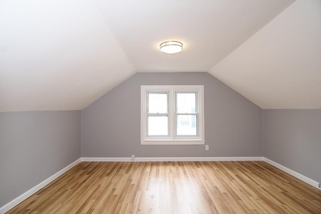 63 Grandview St, Springfield, MA 01118 - additional living space with light wood finished floors, baseboards, and vaulted ceiling