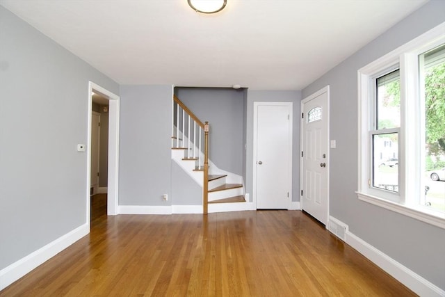 63 Grandview St, Springfield, MA 01118 - entryway featuring light wood-style floors, stairway, and baseboards