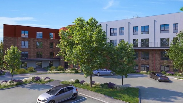 view of property featuring uncovered parking