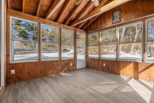 unfurnished sunroom with wooden ceiling and vaulted ceiling