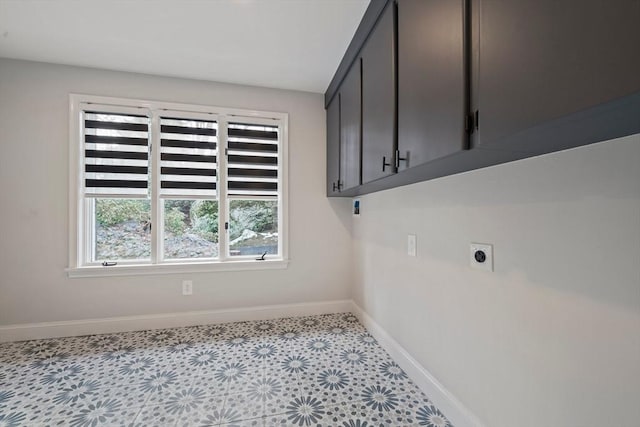 laundry room featuring cabinets and hookup for an electric dryer