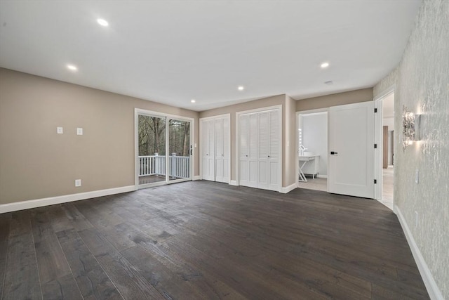 unfurnished room featuring dark wood-type flooring