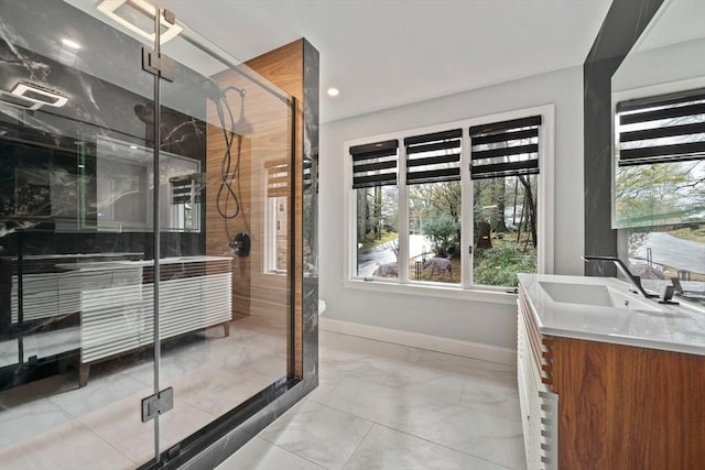 bathroom featuring vanity and a shower with door